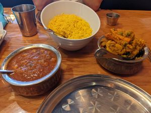 Vegan sabzi (right), basmati rice, and Punjabi chole (chana masala, right) at Apna Indian Kitchen in Santa Barbara