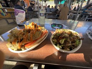 Bomb fried Brussel salad (right) oily crispy savory seasoned perfection. Football sized tempura portobello mushroom pooboy sandwich (left) massive 4 handed mess, very good    at The 05 in Greenville