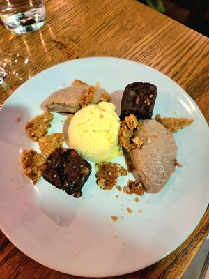 Beet Brownie with red bean mousse, Pineapple orange sherbert, coconut cookie crumble at Nola in Winnipeg