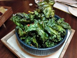 Crispy Fried Kale Leaves with Salted Chilli Spice  S$17 at Cultivate Cafe in Central Singapore