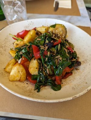Vegan hash with courgette, potatoes, tomatoes, peppers, spinach and pumpkin seeds at Anassa in Crete