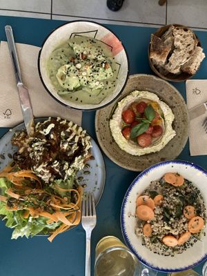 Potatoes galette with eggplant and tomato’s and salad, zucchini ceviche, cashew tartinade, buckwheat risotto.   at Mariposas in Marseille