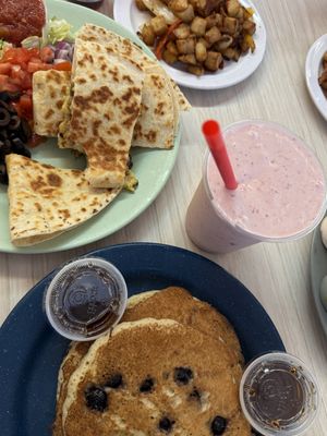 Vegan Strawberry Milkshake, Vegan Breakfast Quesadilla comes with home fries, Vegan Blueberry Pancake Stack comes w a “meat" (I did bacon)  at Mattie's Diner in Charlotte
