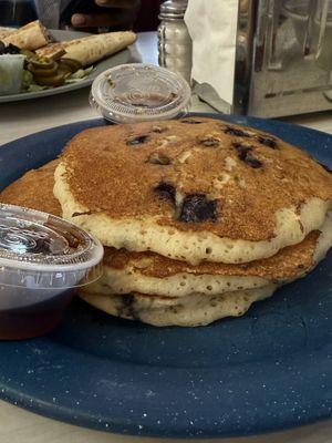 Vegan Blueberry Pancake Stack comes w three pancakes and includes a flavor type (blueberry here) served with table syrup   at Mattie's Diner in Charlotte