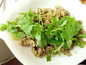 Spelt Pasta with pesto, pine nuts, tomato, rocket salad at Vapiano - Constantinstraße in Cologne
