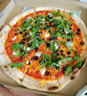 Black olives, vegan feta and arugula at Pizza Z Piecca in Warsaw