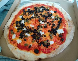 Black olives, vegan feta and capers at Pizza Z Piecca in Warsaw
