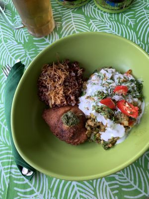 Akar Cafe - Indian chickpea, eggplant and spinach curry with red rice and samosa at Akar Cafe in Lovina