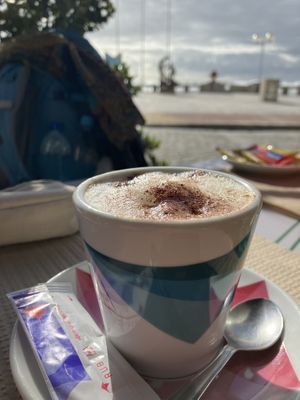 Cappuccino mit Hafermilch  at Café Oceano in Vila Praia De Ancora