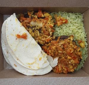 Vegan Shami Kababs: patties of black beans & house spice mix, pan-seared & served w/ green chutney, onions, tomatoes, tortillas, & jalapeño rice at Curry in a Hurry in Omaha