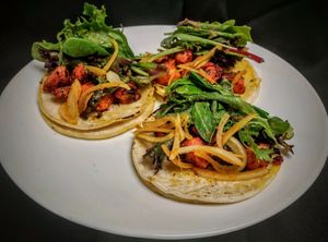 Vegan Shrimp Tacos made with sauteed vegan shrimp in achiote sauce, house salsa and mixed greens served in three (3) fire roasted soft shell corn tortillas for #veganwed. at Curry in a Hurry in Omaha