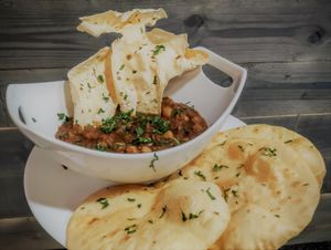 Chole Poori: Spicy & flavorful curry with garbanzo beans, spices and herbs served with a side of Poori (an unleavened fried bread). Also comes with a side of Papadum. at Curry in a Hurry in Omaha