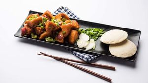 Hongkong Idli: A popular Indo-Chinese dish made with fried Idli (race cakes) tossed with garlic, bell peppers, onions and spring onions. at Curry in a Hurry in Omaha