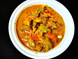 A versatile dish that packs in a burst of flavors from earthy mushrooms, tart tomatoes, and aromatic spices🌶️🌿 .  Served over long grain basmati saffron rice. at Curry in a Hurry in Omaha