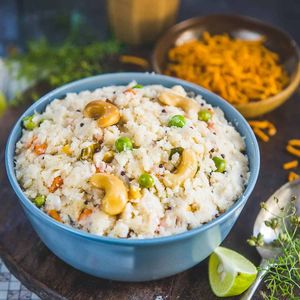 Upma is a flavorful South Indian breakfast dish made from rava/farina. Cooked with roasted Rava, husked urad dal (lentils), ginger, curry leaves, thai green chilies & veggies at Curry in a Hurry in Omaha