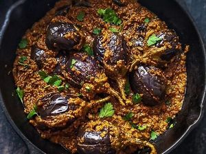 Gutti Vankaya Kura: A specialty dish from the Andhra Cuisine. Small, tender, purple eggplants filled with freshly made spicy, peanut filling & cooked in a delicious tamarind gravy at Curry in a Hurry in Omaha
