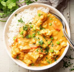 Vegan Korma: A delightful medley of fresh vegetables simmered to perfection in a creamy spiced cashew-coconut curry sauce. at Curry in a Hurry in Omaha