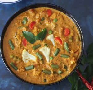 Chettinad Mixed Vegetable curry: A mixture of assorted spices, an aromatic curry base of cashews and coconut milk. Served over long grain basmati saffron rice. at Curry in a Hurry in Omaha