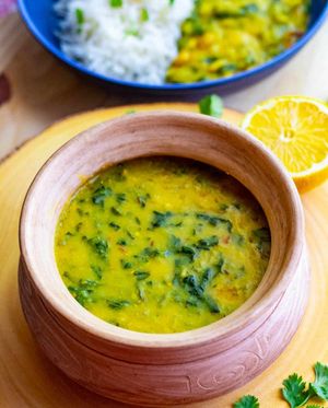 Daal Palak: A nutritious and comforting dish featuring lentils (dal) cooked with fresh spinach (palak) and aromatic spices  at Curry in a Hurry in Omaha