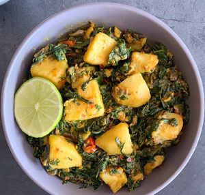 Aloo Palak: A popular North Indian dish that combines tender potatoes (aloo) with nutritious spinach (palak) in a flavorful curry. at Curry in a Hurry in Omaha