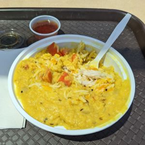 Dhaba Style Daal Tadka: a blend of toor dal, moong dal, & masoor dal, stirred w/ whole Indian spices & ginger, served over long grain Basmati rice at Curry in a Hurry in Omaha