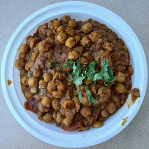 Chana Masala: spicy & flavorful curry w/ chickpeas, spices, & herbs, served over long grain saffron Basmati jeera (cumin) rice at Curry in a Hurry in Omaha