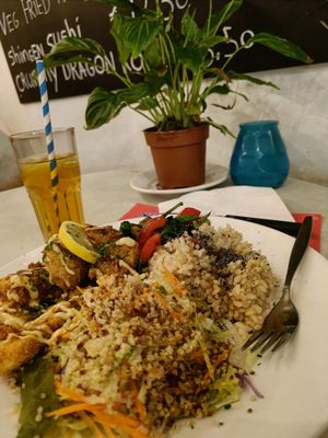 Vegan Plate ("chicken" crisps, stirfry, rice, salad) with unsweetened iced tea. at TerraZen Centre in Amsterdam