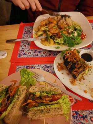 BLT, Half eaten dragon roll and Jamaican plate at TerraZen Centre in Amsterdam