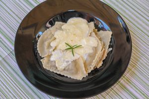 Ravioli Cretan stuffed with Mushrooms and Rosemary 							  
-Served with white sauce of cheeses)
 at Kriton Gefsis in Aegina in Aegina