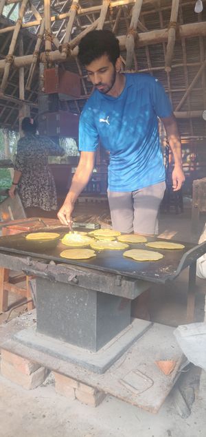 Cooking some delicious vegan banana pancakes! at Sadhana Forest Seva Kitchen in Auroville