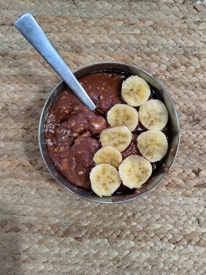 Breakfast millets along with fruits at Sadhana Forest Seva Kitchen in Auroville