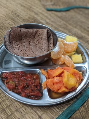 Pancakes with jam and fruits at Sadhana Forest Seva Kitchen in Auroville