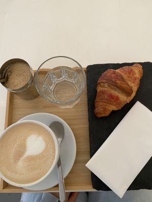 dirty chai latte and croissant   at Robert Capa Café in Budapest