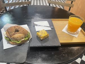 Tofu bagel, passionfruit slice and orange juicee  at Robert Capa Café in Budapest