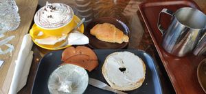 Hot chocolate, croissant, bagel with cheese & ham, hot press coffee at Valkyrjan Bistro & Bar in Reykjavik