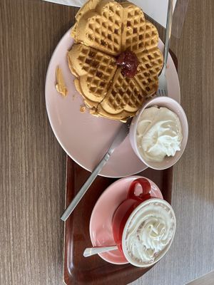 Waffles cream and strawberry jam with creamy hot cocoa   at Valkyrjan Bistro & Bar in Reykjavik