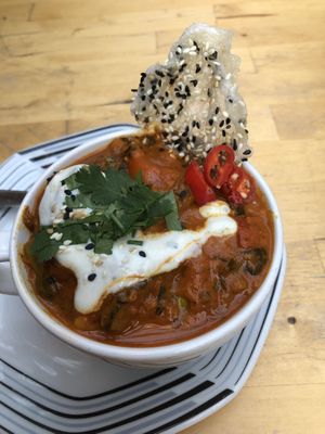 Crazy yummy, bright curry dish with fresh veggies and just enough spice  at EmmaPea Vegan Food and Bar in Berlin