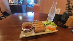 Spring rolls. Fresh carrot juice at CHAYFOOD in Hanoi