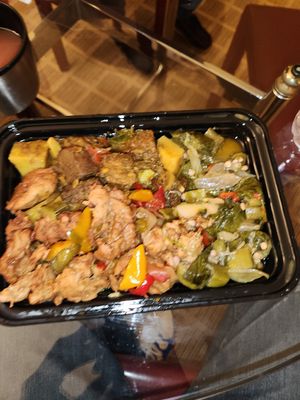 Mock curry goat, mock teriyaki chicken, okra, callalooand steamed green banana. at Holy Fruits Juice Press in Bronx