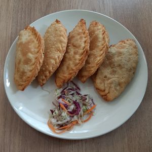 Khuushuur, cabbage salad at Loving Hut - Meditation Center in Ulaanbaatar