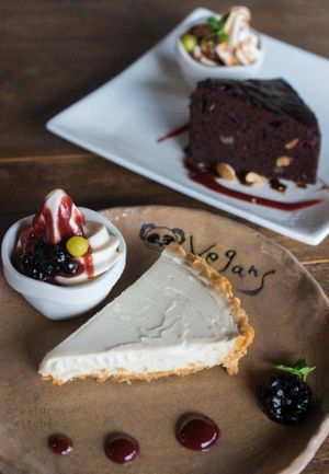Lemon cheese cake and chocolate cake with vanilla soft serve. at Vegans Cafe and Restaurant in Kyoto
