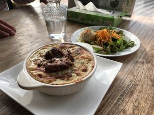 Milan style brown rice casserole with white sauce set with a salad at Vegans Cafe and Restaurant in Kyoto