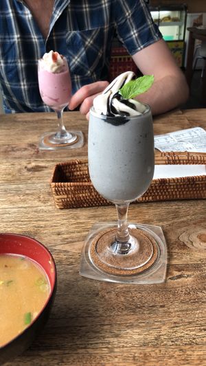 Black sesame milkshake front, strawberry milkshake back at Vegans Cafe and Restaurant in Kyoto