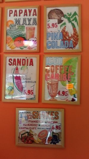 Signs behind the bar advertise some of the juices and other drinks available at Sunfrost Farm's counter and bar. Picture taken July 2021.  at Sunfrost Farms in Woodstock