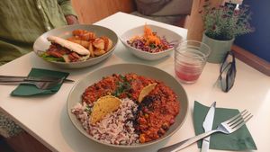 Chilli tofu with rice. Jackfruit with roasted potatoes and salad. at  Vegigan in Tenerife
