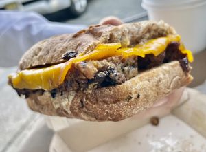 Vegan Scrapple Sandwich - housemade vegan scrapple, vegan gouda, maple syrup spread, on a cinnamon raisin philly muffin  at Haddon Culinary in Collingswood