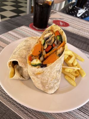 Awesome Roasted vegetables and hummus wrap with chips  at Smith's Restaurant Café Bar in Mallorca