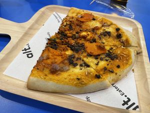 Meaty pizza half, 200 baht  at alt.Eatery in Bangkok