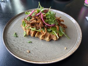 Funghi with potato waffle: very flavoursome with well-marinated oyster mushrooms. The potato waffles contained nice herbs as well.  at Cravings For Green in Ede