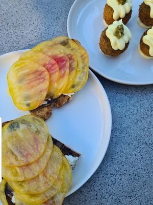 Tomatoes on toast & Potato croquettes at Plates in London